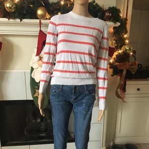 White sweater with orange stripes